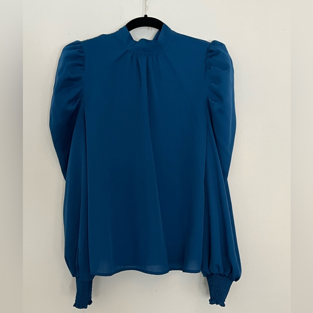 Deep blue dressy high neck blouse with neck tie.